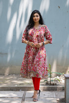 Vanamaala Kalamkari kurta — walking pose showing calf length silhouette and deep side slit