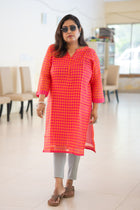 Anuradha orange pink check cotton kurta — side profile view showing midi length and side slit
