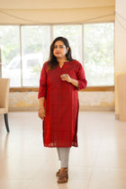 Raktim deep red handwoven kurta — side profile view showing midi length