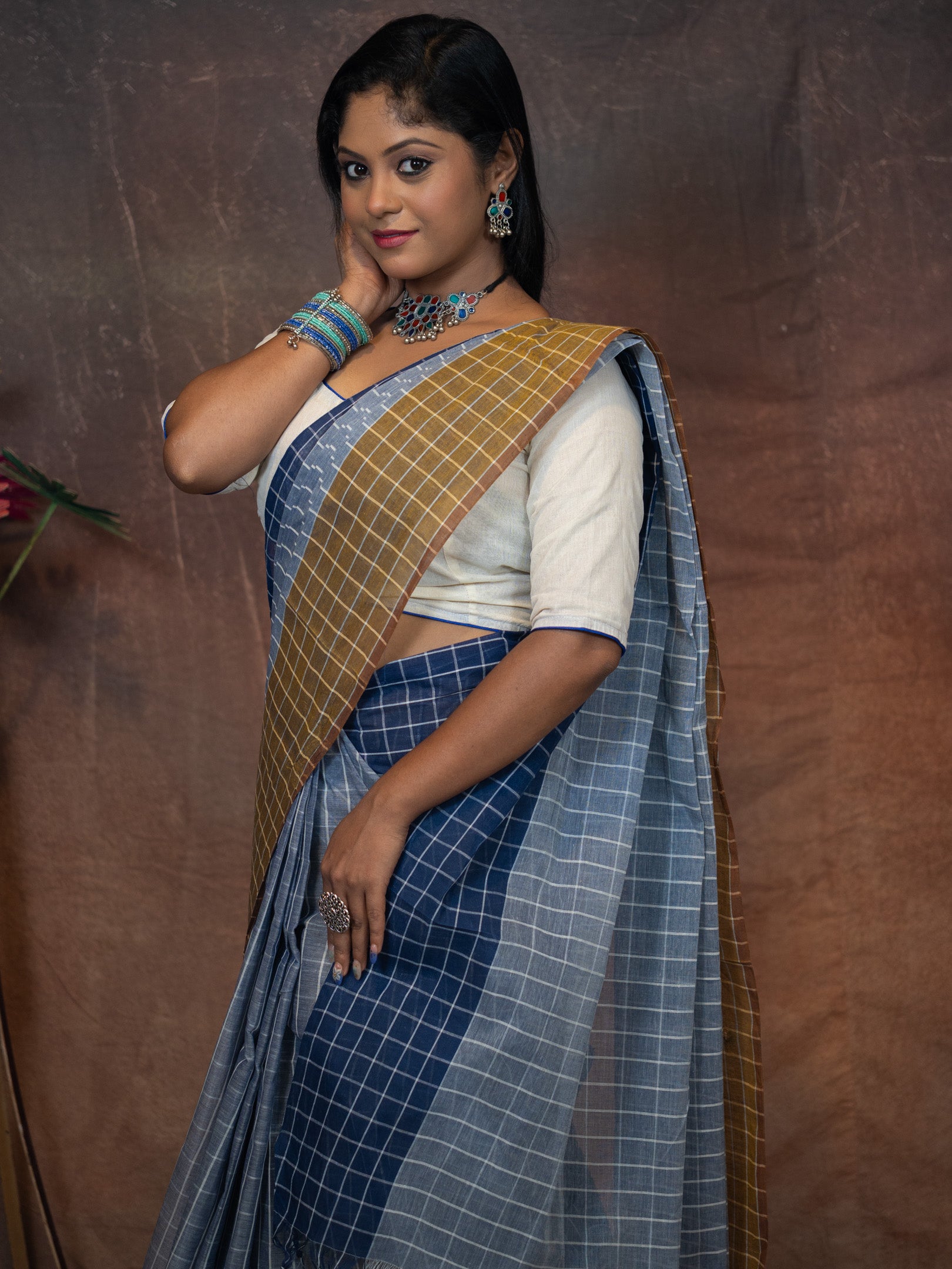 Soothing grey-blue base  Saree